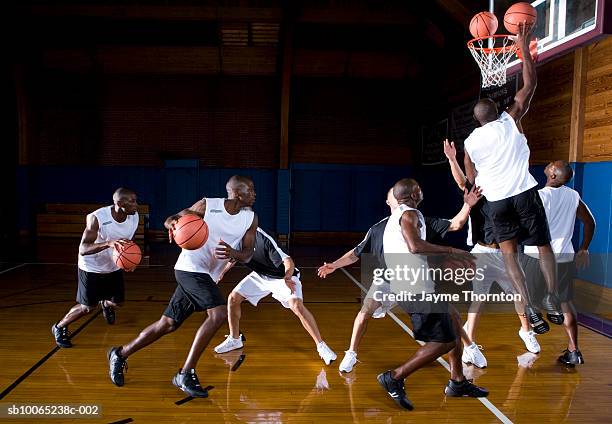 basketball players playing on court (digital composite) - double exposure running stock pictures, royalty-free photos & images