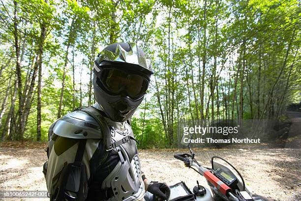 mature biker on motocross in forest - chest protector stock pictures, royalty-free photos & images