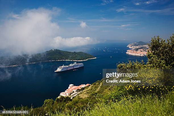 cruise ship in adriatic sea with dubrovnik in background - dalmatia region croatia stock pictures, royalty-free photos & images