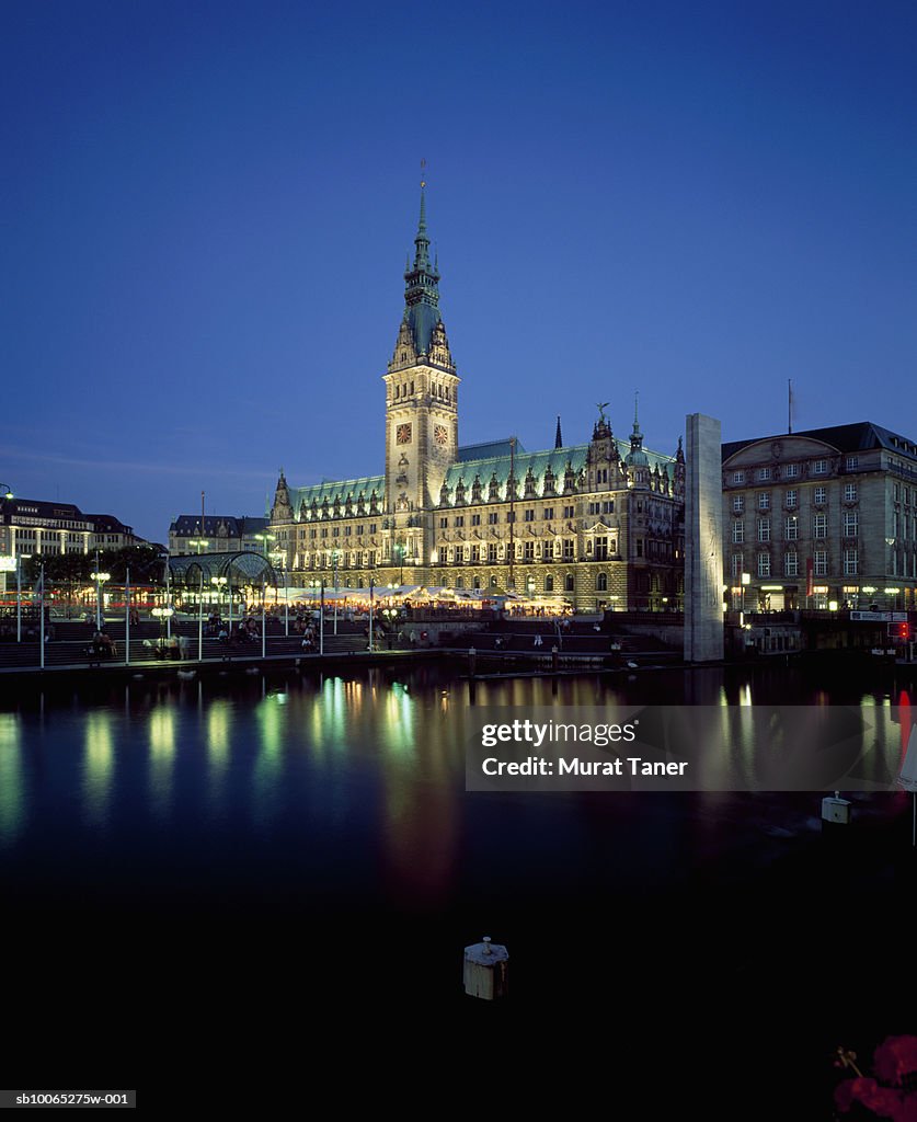 Hamburg Town Hall (Rathaus) reflecting in water at dusk