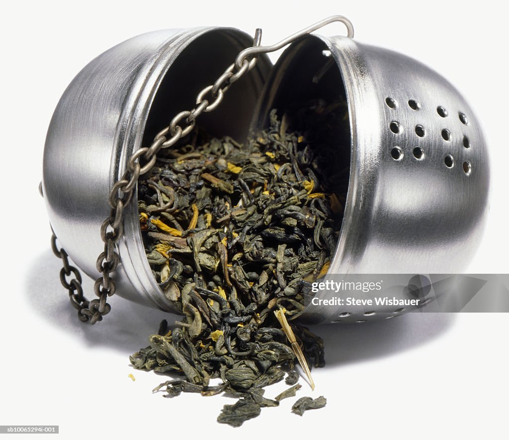 Green tea in open infuser, studio shot, close-up