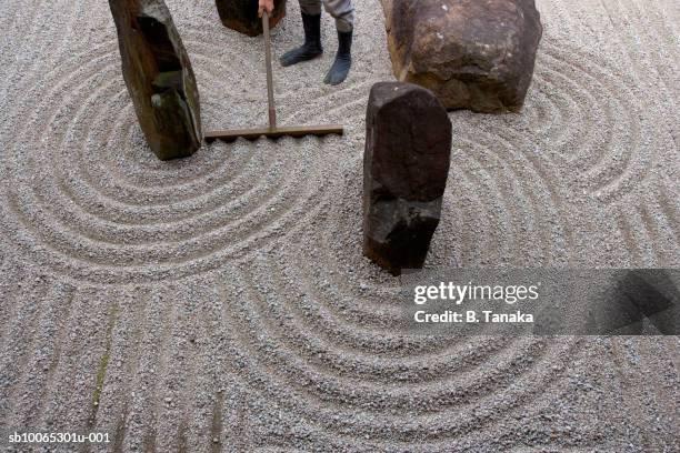 man working in garden, low section, elevated view - zen garden stock pictures, royalty-free photos & images