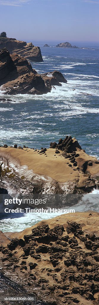 USA, Oregon, near Charleston, waves breaking on rocks at Shore Acres State Park