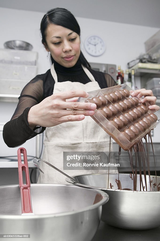 Young woman making chocolate