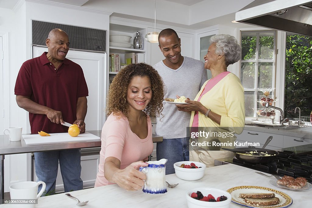 Family cooking in kitchen