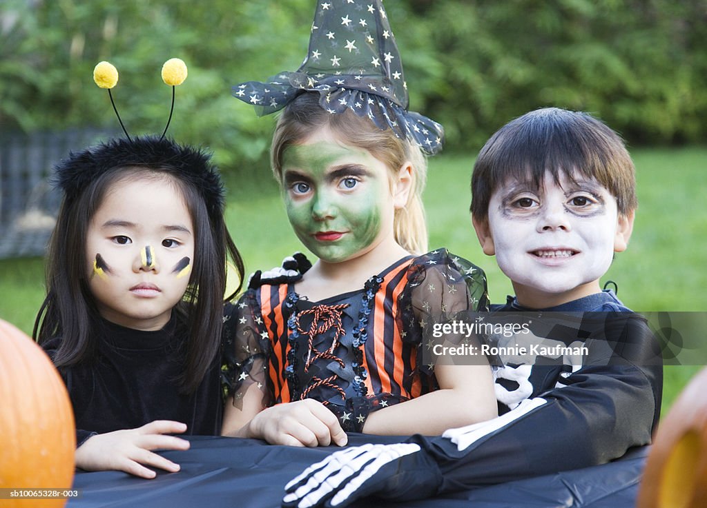 Children (4-5) wearing fancy dress costume, close-up