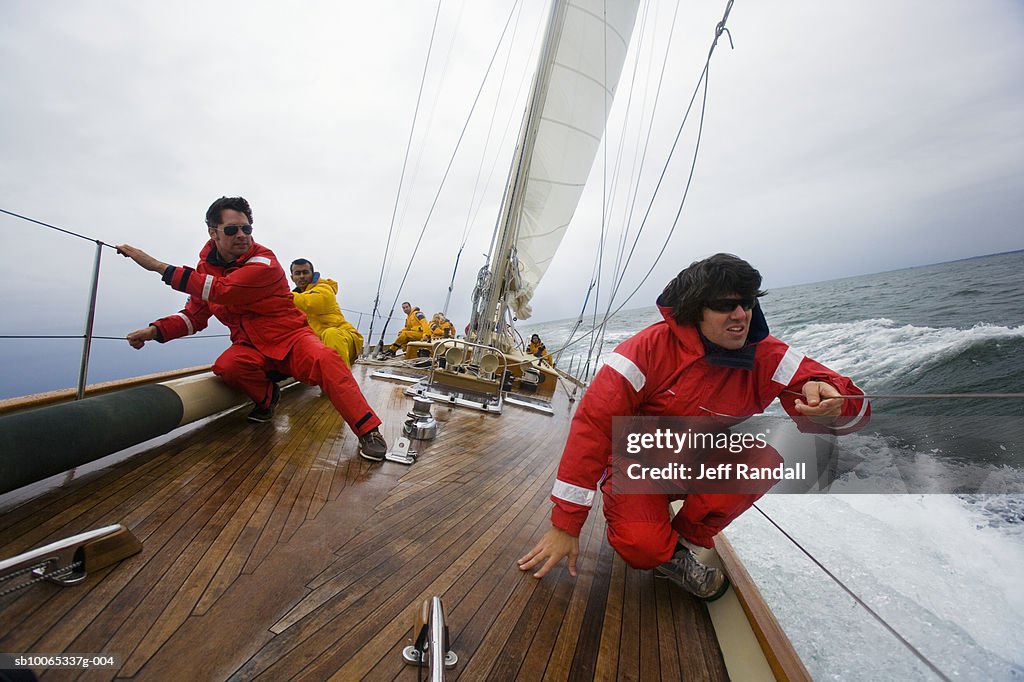 Crew members on racing yacht