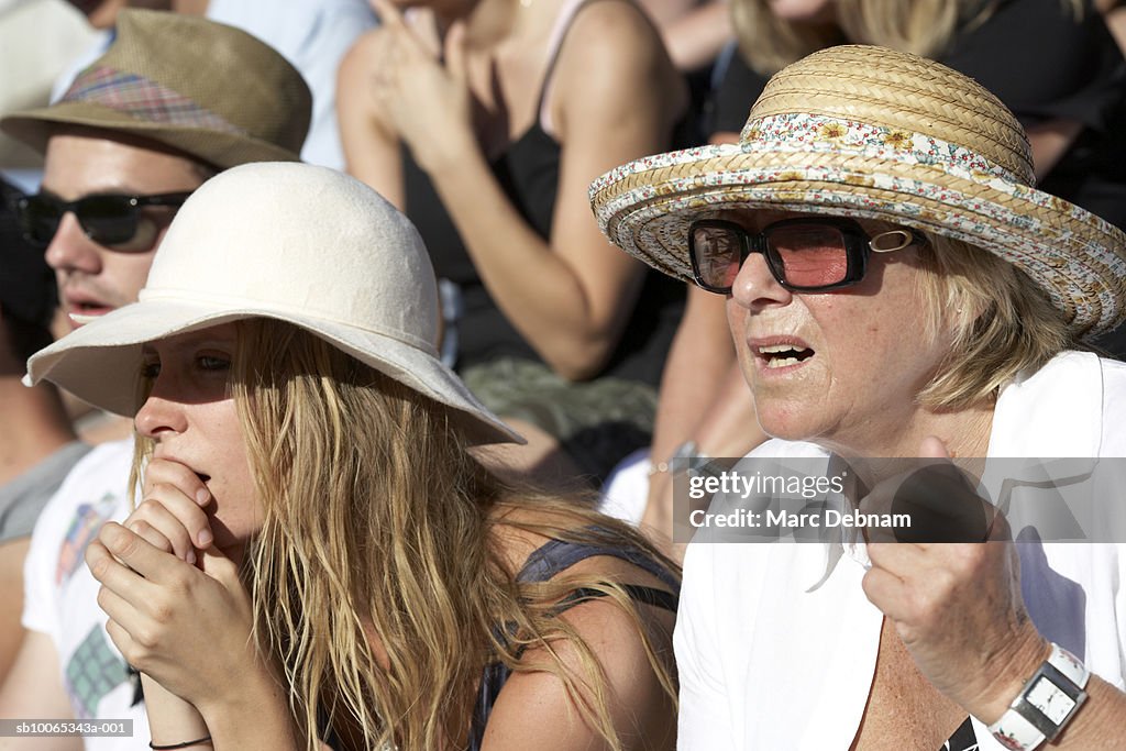 Spectators in crowd, close-up