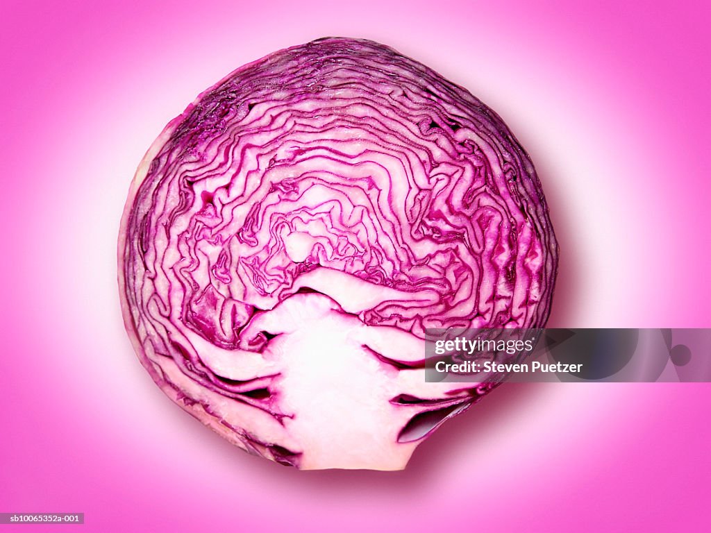 Cross-section of savoy cabbage against purple background