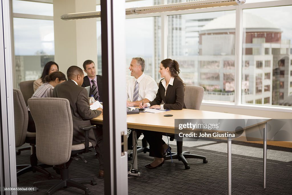 Business executives discussing at conference table