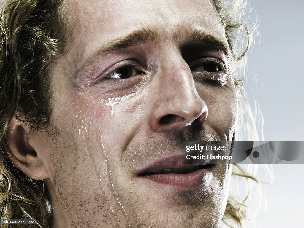 Young man crying, close-up