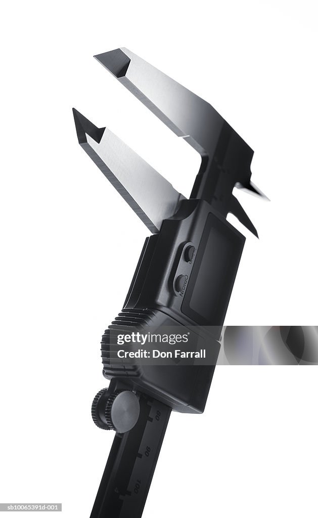 Digital caliper on white background, close-up