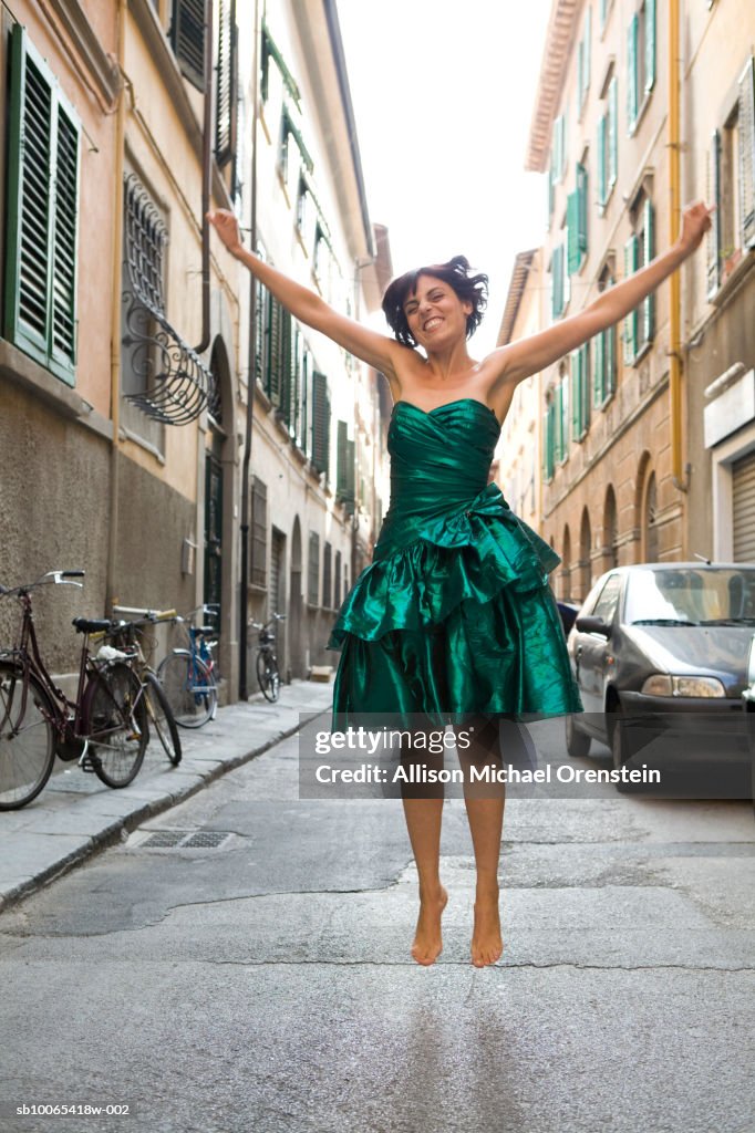 Woman jumping in street