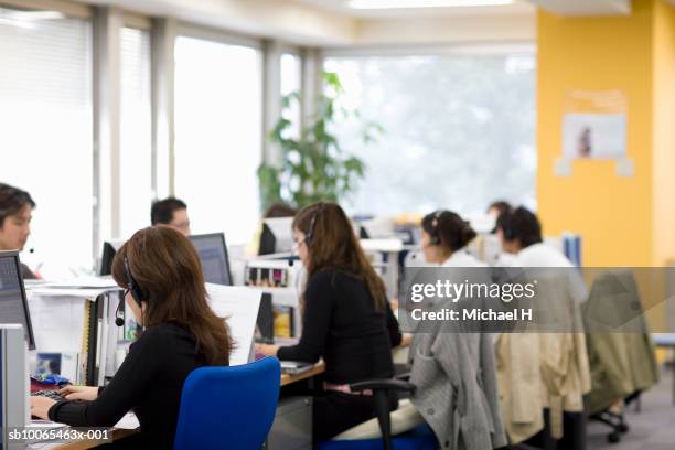 office workers working in office - callcenter bildbanksfoton och bilder