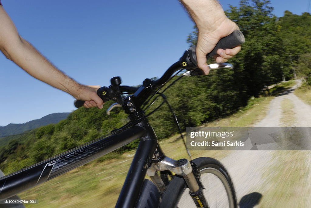 Man speeding on mountain bike (blurred motion)