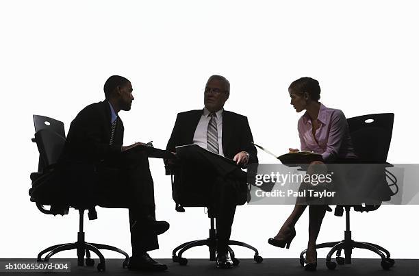 three business executives having meeting - mulher num grupo de homens imagens e fotografias de stock