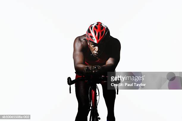 triathlete riding on bicycle - indoor triathlon stock pictures, royalty-free photos & images