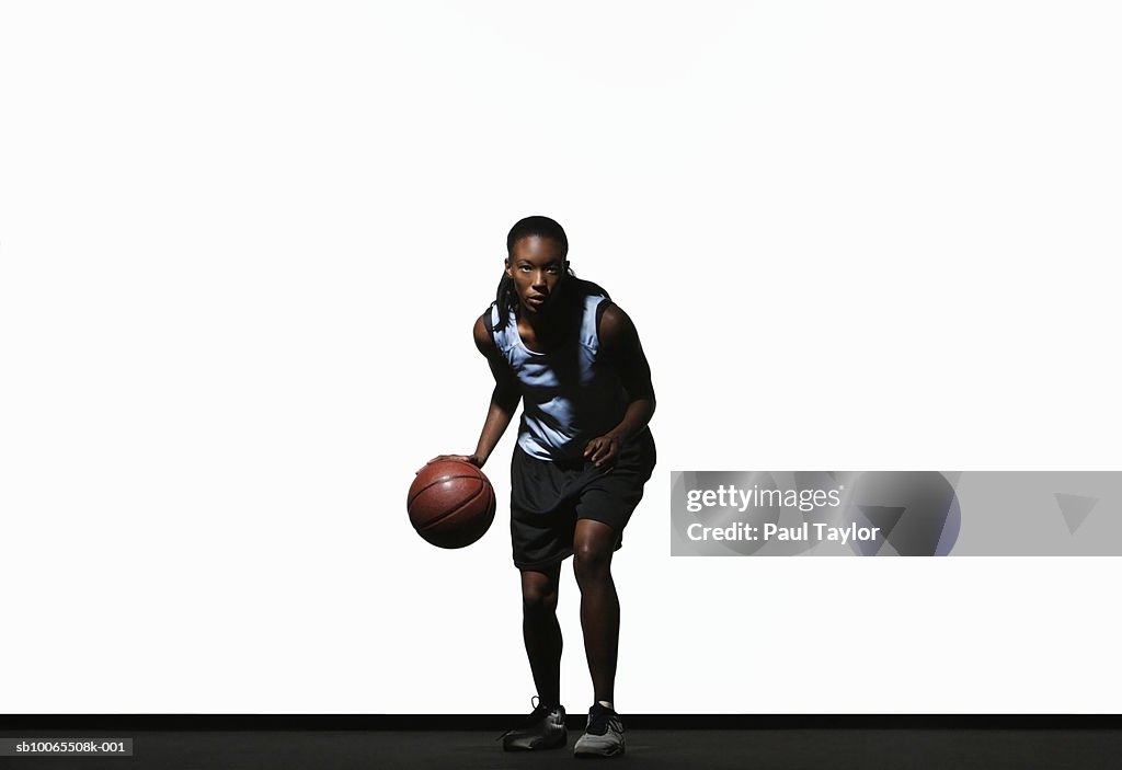 Young woman holding basketball