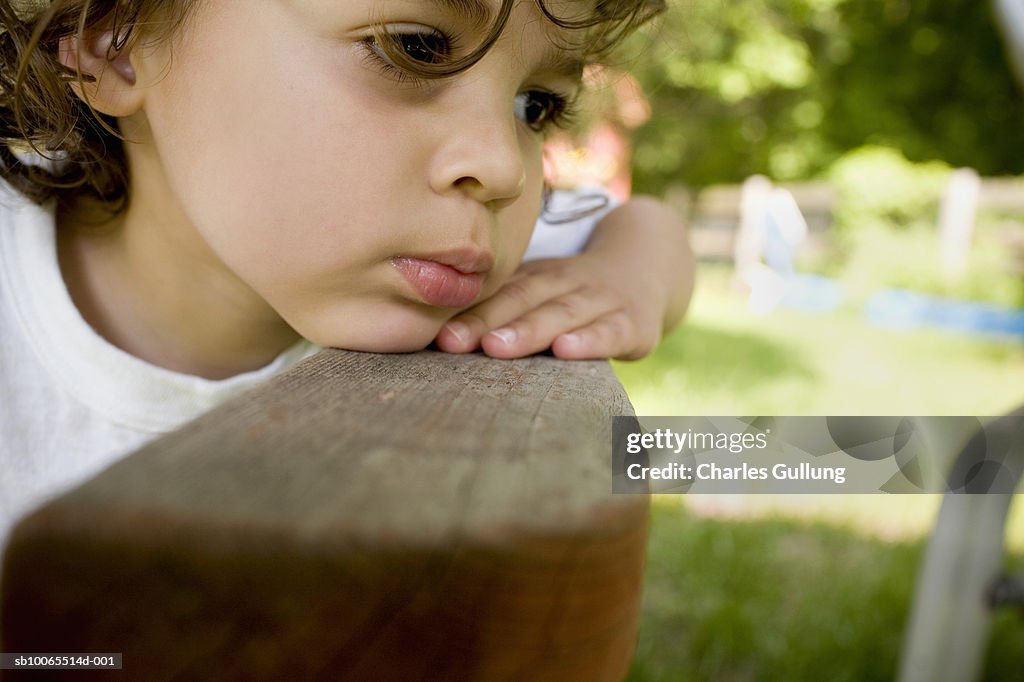 Boy (2-3) looking away