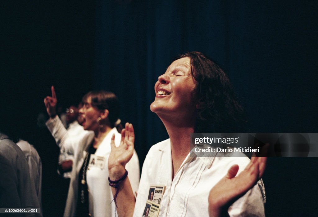 Woman praying during religious event
