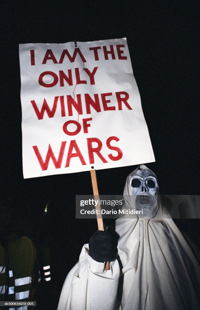 Protestor in costume with placard