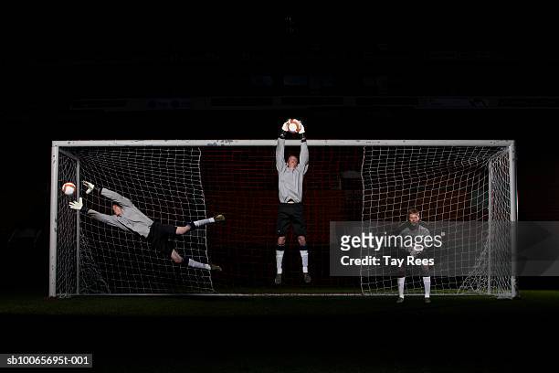 goal keeper saving goal - defender soccer stock pictures, royalty-free photos & images