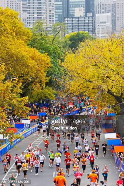 marathon runners on road - marathon new york stockfoto's en -beelden