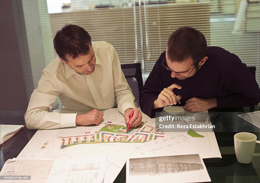 Two architects discussing plans