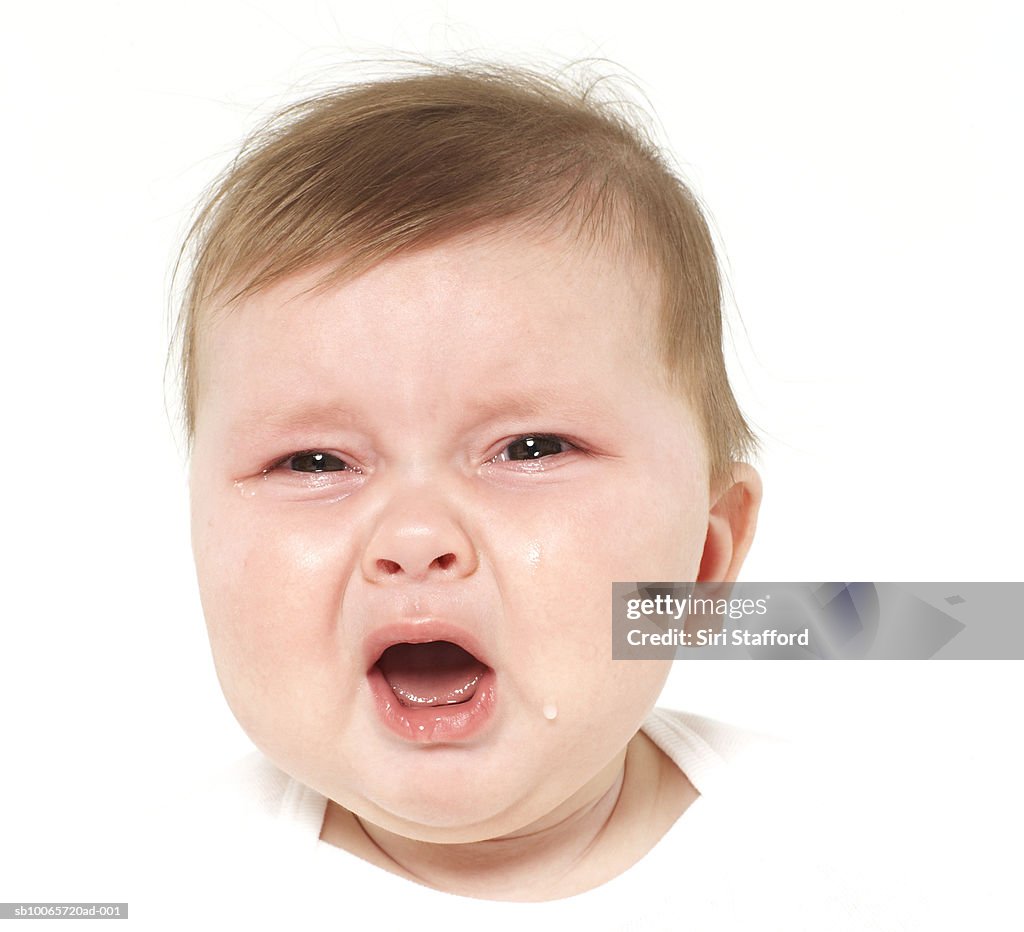 Baby boy (6-9 months) crying, portrait, close-up