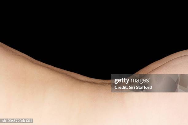detail shot of curve of male baby's (6-9 months) back - glutei foto e immagini stock