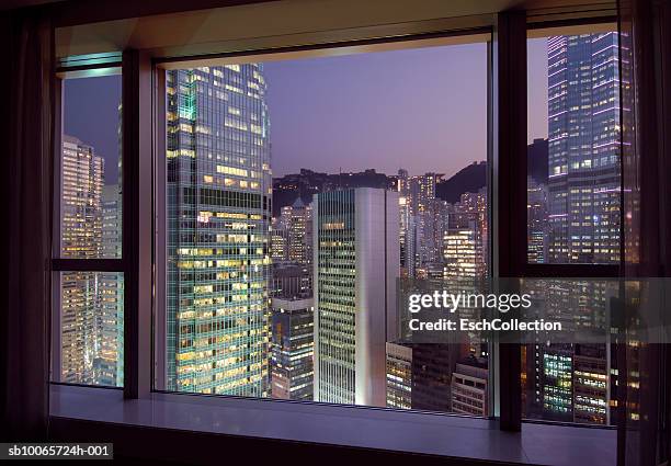 hong kong, central district at sunset seen from room - office skyscraper stock pictures, royalty-free photos & images