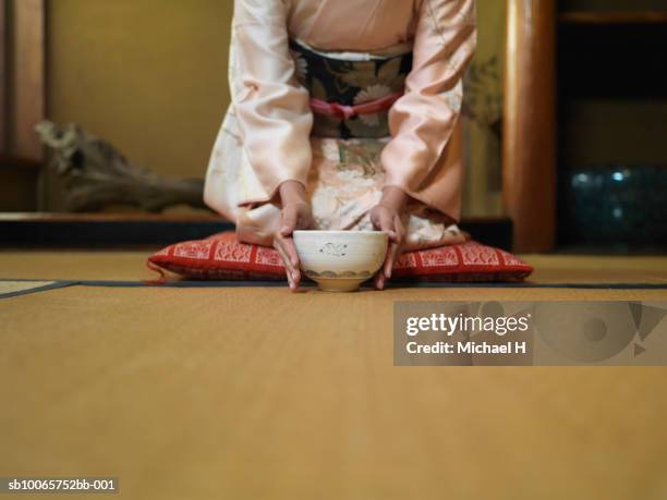 woman kneeling down tea bowl, mid section - teceremoni bildbanksfoton och bilder