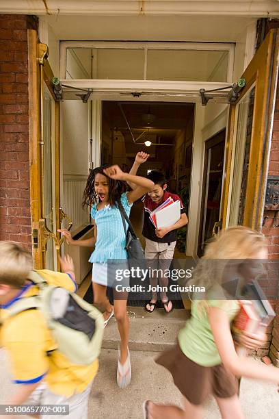 children (8-15) leaving schools, cheering, blurred motion - leaving school imagens e fotografias de stock