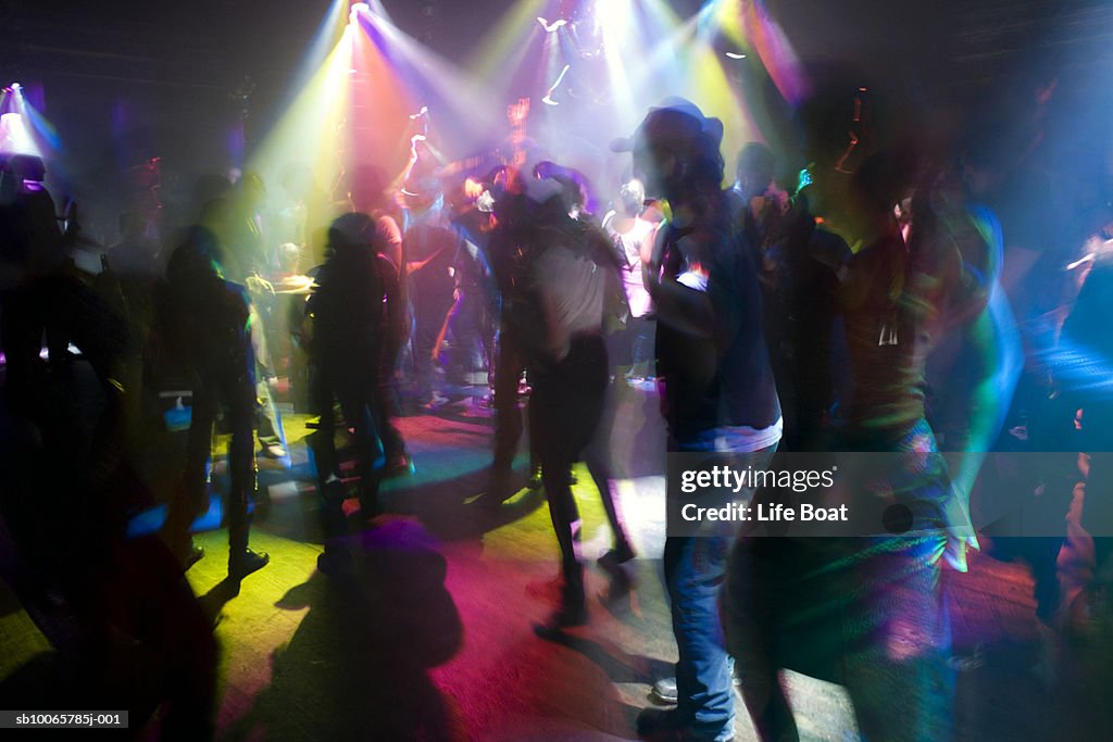 People dancing in night club