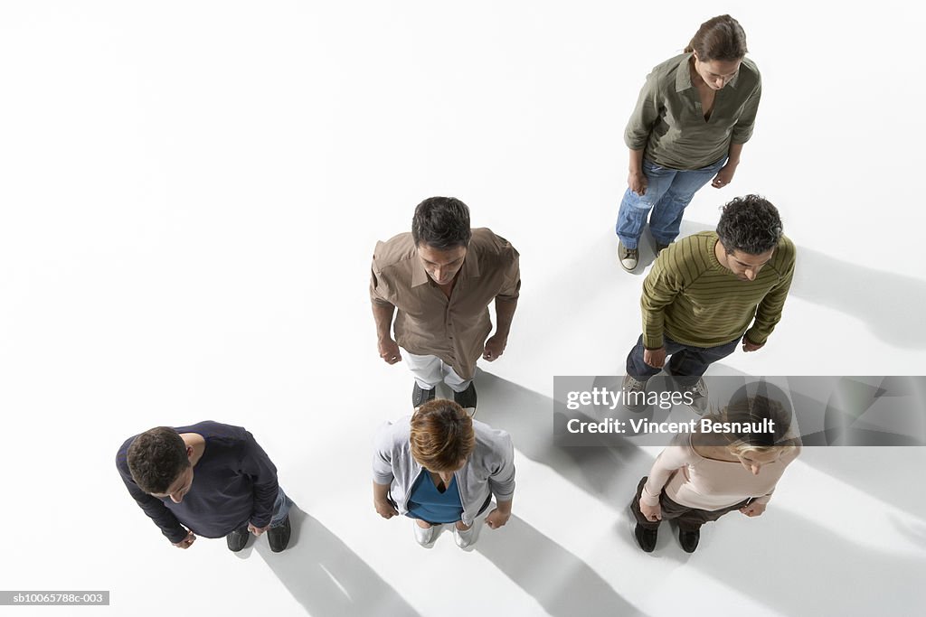 Six people standing in lines