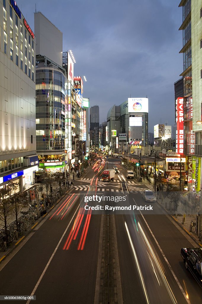 Japan, Tokyo, cars on downtown street at dusk, long exposure