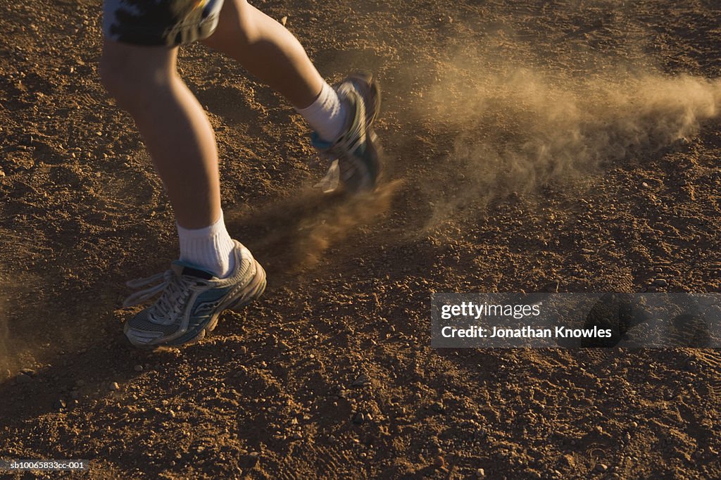Person running on dust, low section