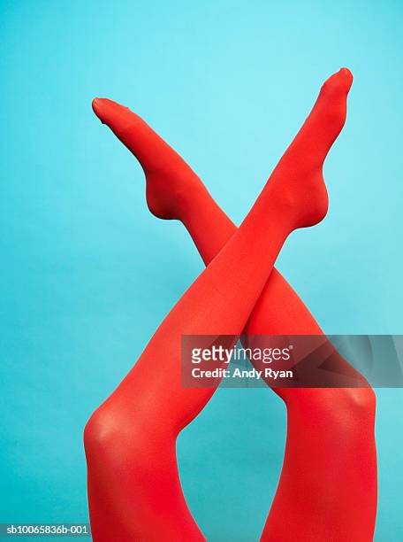 person wearing red legging, low section, close-up - legs in nylon bildbanksfoton och bilder