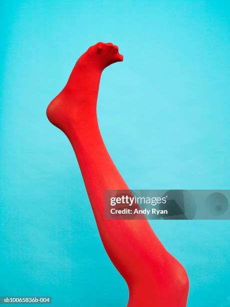 person wearing red legging, low section, close-up - damstrumpor bildbanksfoton och bilder