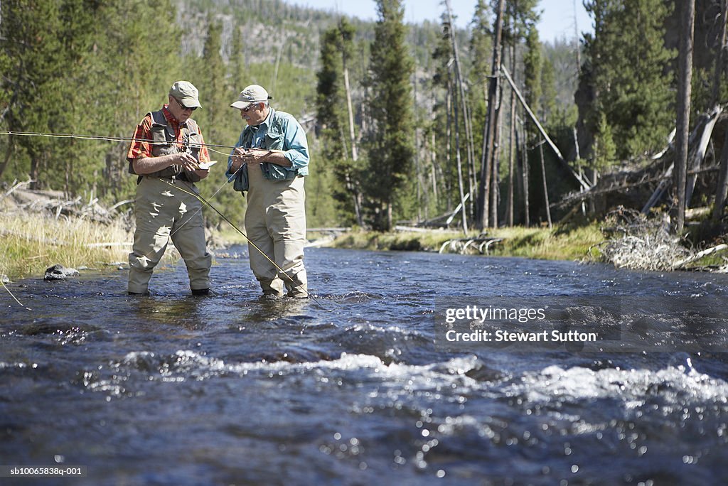 Two men flyfishing in river