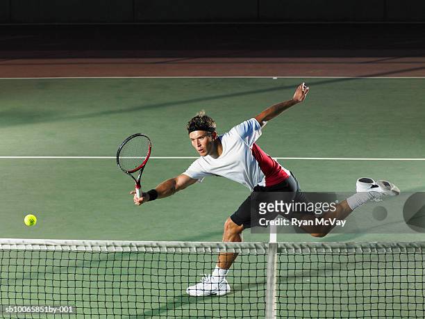 young man playing tennis - match sport stock-fotos und bilder