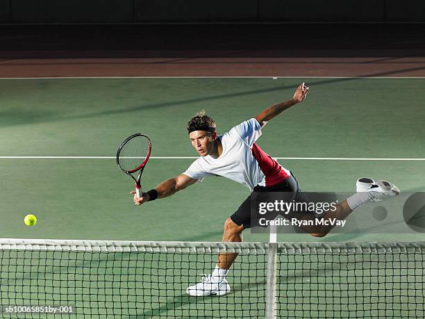 young man playing tennis - tennis court stock pictures, royalty-free photos & images