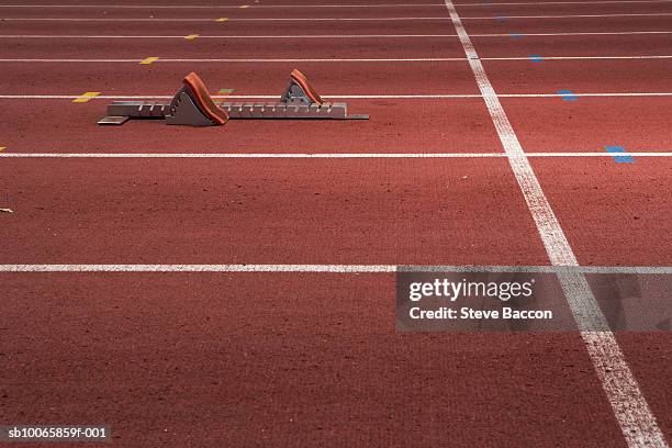 starting block on running track - track starting blocks stock pictures, royalty-free photos & images