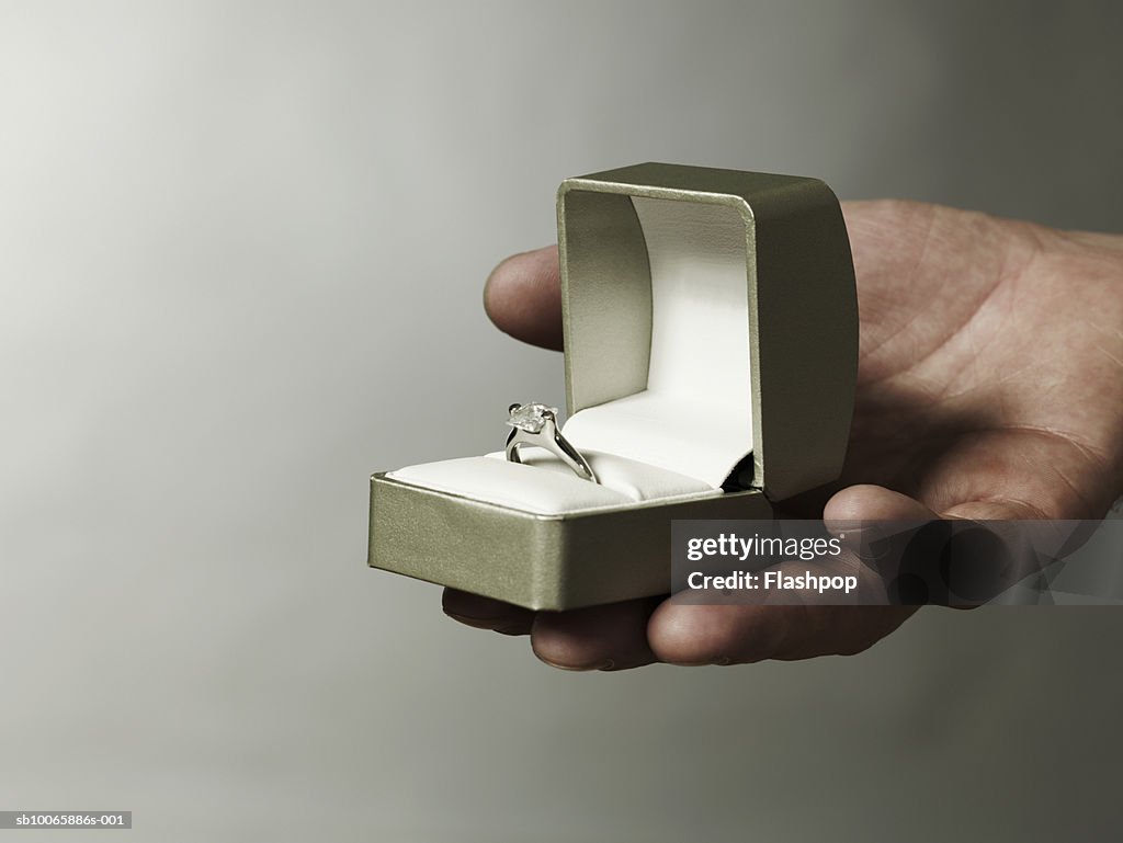 Man holding engagement ring