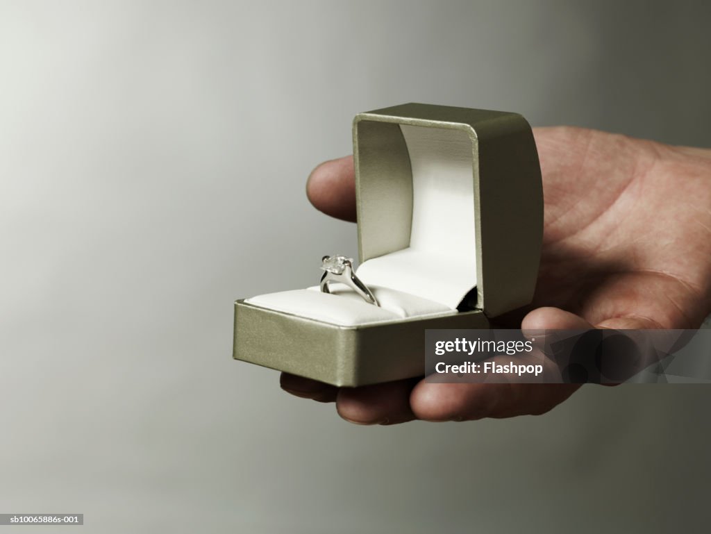 Man holding engagement ring