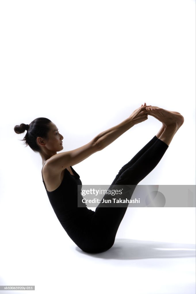 Woman sitting in yoga position