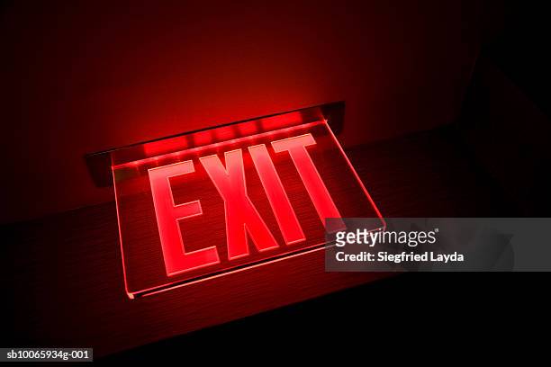 exit sign illuminated, close-up, low angle view - exit sign ストックフォトと画像