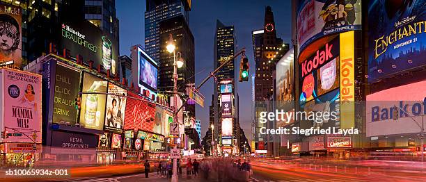 traffic in times square at dusk (blurred motion) - broadway manhattan stock pictures, royalty-free photos & images