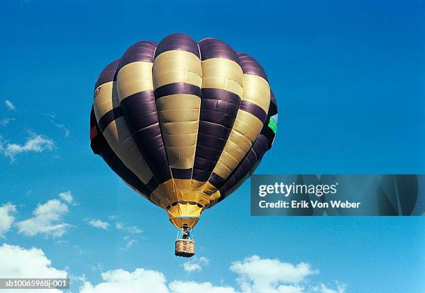 hot air balloon against bright blue sky, low angle view - low flying aircraft bildbanksfoton och bilder