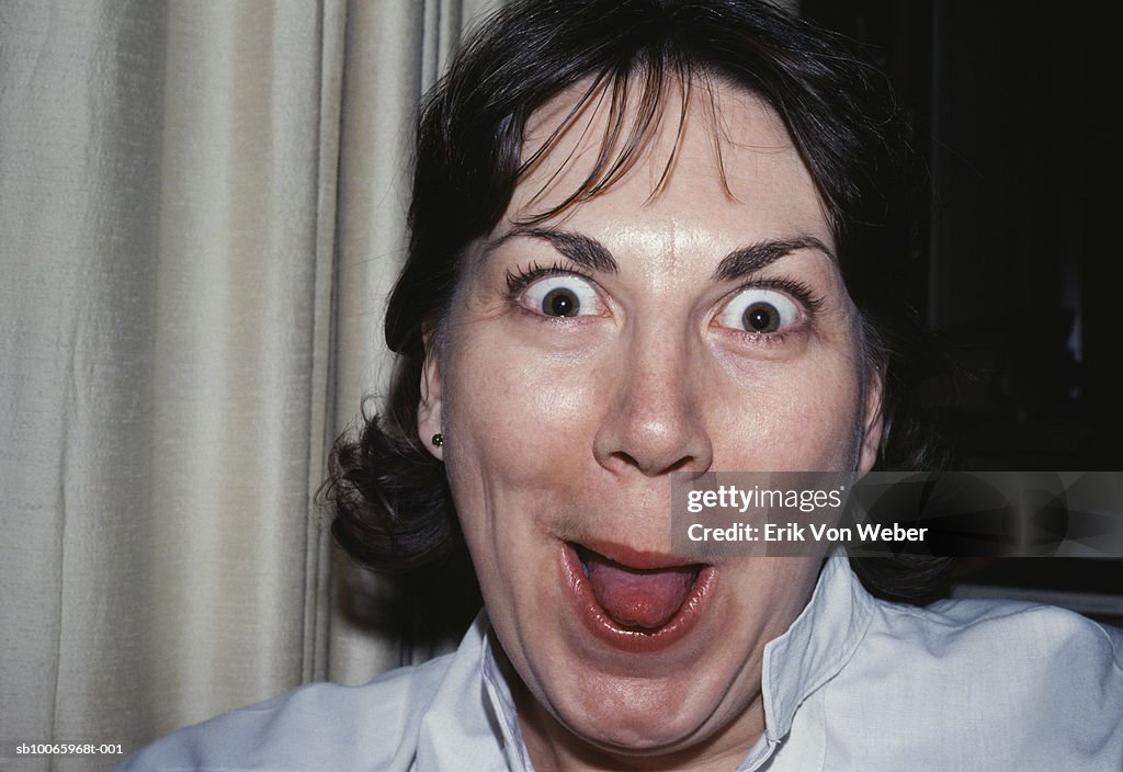 Woman making funny faces, portrait, close-up